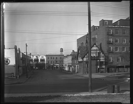 Esplanade; street scene ; partial view of A.M. Caden; Lexington Automobile Club Automotive Association of America (AAA); Walton Building; Miles Coffee House