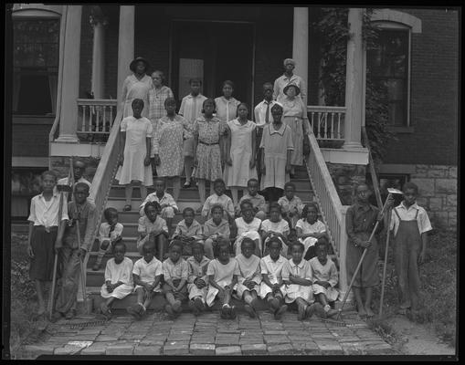 Colored Orphans' & Industrial Home, 644 Georgetown; exterior, group on porch (African-American)