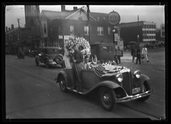 American Legion Parade; out of focus car with rider and driver