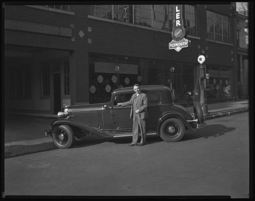 Barney Oldfield; car in front of Kinkead-Wilson Motor Company (177, 179 South Mill) (Chrysler-Plymouth dealership)