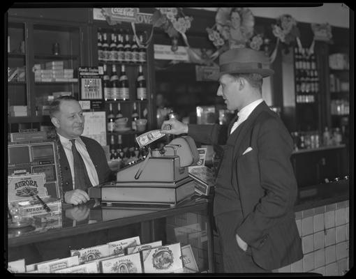 Fitzhugh Pharmacy, 848 East High (posed transaction at cash register)