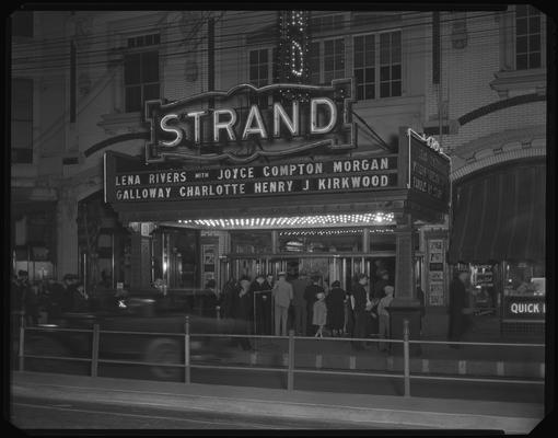 Strand Theatre (movie theater), 153 East Main, exterior, street scene; nighttime marquee for 