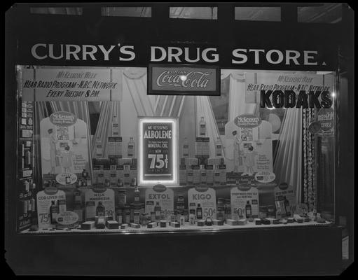 Curry's Drug Store, 101 West Main; exterior window