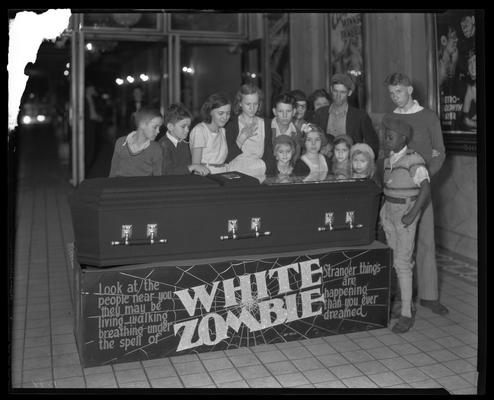 Ben Ali Theatre (movie theater), 121 East Main, interior, lobby; children looking into coffin, part of the promotion for 
