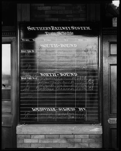 Southern Railway System; train schedule on chalkboard