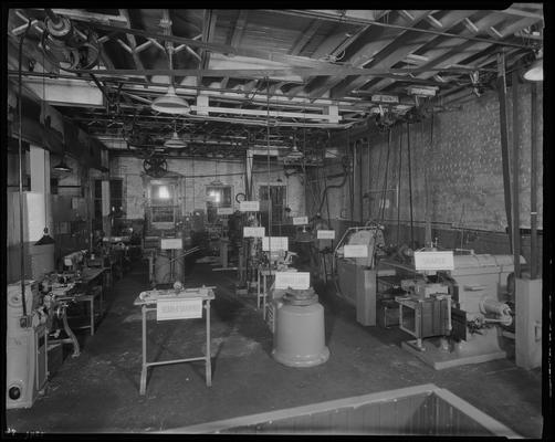 Wombwell Automotive Parts Company, 151 East Short; interior (machines, labeled)