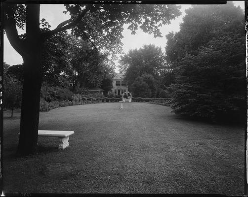 W.R. Milward (159, 161, 163, 165 North Broadway); flower garden (Funeral Home)