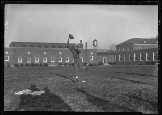 University High; football player, catching a pass