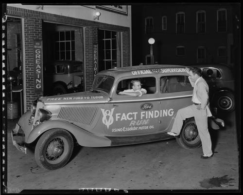 Standard Oil Company; Southeast corner of Woodland and High; Ford car at station (V-8 Fact Finding Run car, Tudor, Essolube Motor Oil)