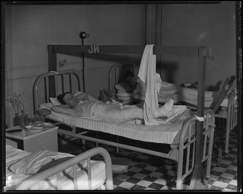 Lenville Combs; man in bed at Good Samaritan Hospital, 310-330 South Limestone