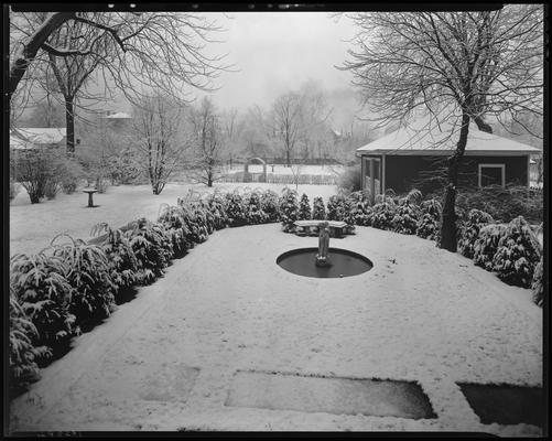 W.R. Milward (159, 161, 163, 165 N. Broadway); snow scenes in garden (Funeral Home)