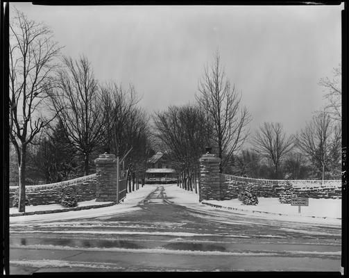 John E. Madden; snow scenes, gates to house