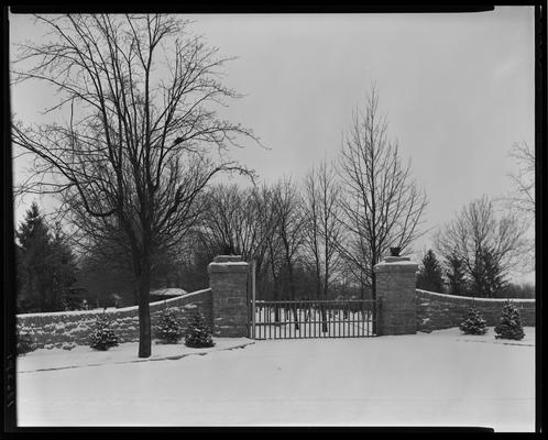 John E. Madden; snow scenes, gates to house