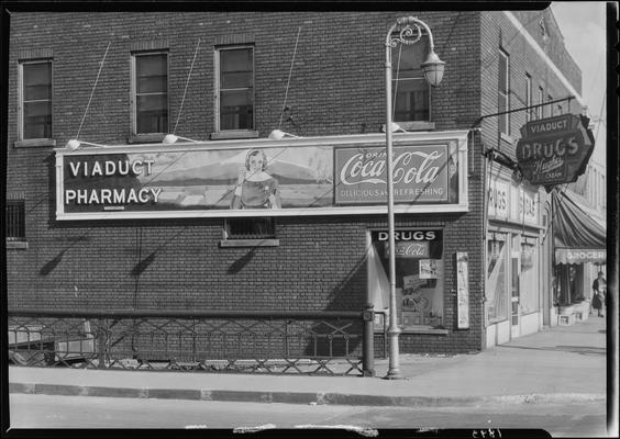 Coca-Cola sign; Viaduct Pharmacy (drug store)