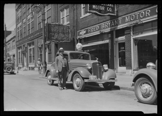 Fred Bryant Motor Car Company, 728 Bullock Avenue; exterior, man and car