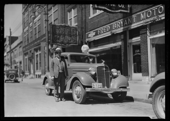 Fred Bryant Motor Car Company, 728 Bullock Avenue; exterior, man and car