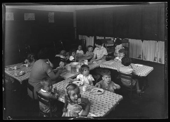 University kindergarten; interior, children eating