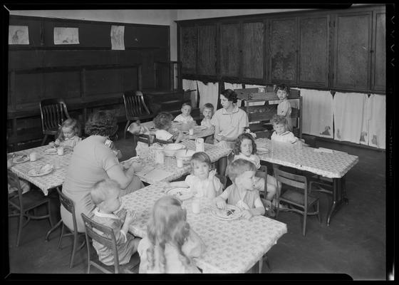 University kindergarten; interior, children eating