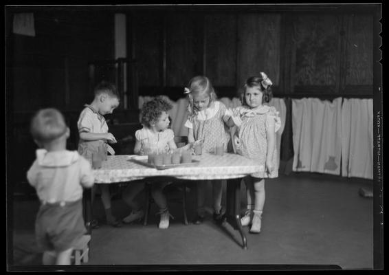 University kindergarten; interior, children eating