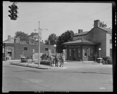 Red Harris and Fuzzy Farris; service station (gasoline), exterior; 3rd (Third) and Walnut