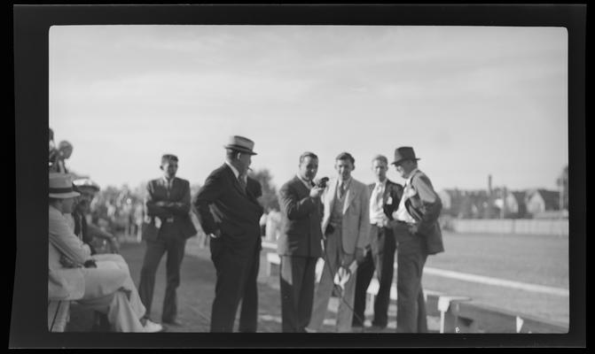 University of Kentucky; football game; coaches discussing on field