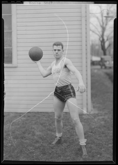 Transylvania College; basketball player; Moore; man standing in front of building