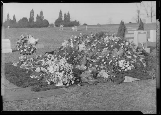 George McDaniel; grave with flowers covering top