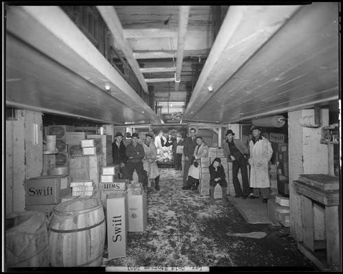 Lexington Cold Storage Plant, Swift & Company (wholesale dairy, cream; 412-414 West Short); men gathered in storage room