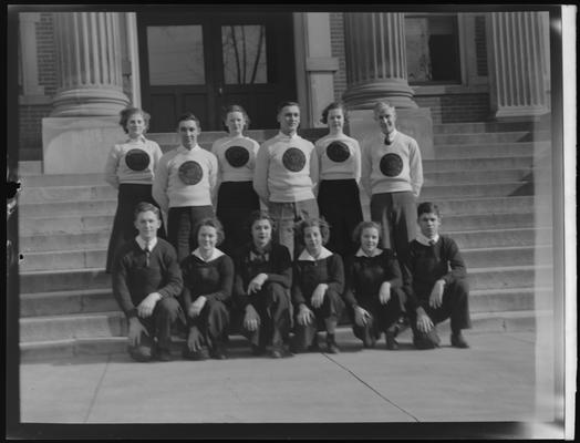 Paris High School ; group of students sitting and standing on steps of building; shirt read, 