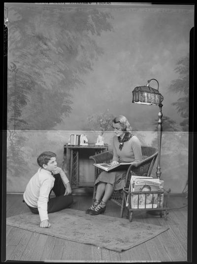 Henry Clay High School (701 East Main) Aurataim Scenes; woman sitting in chair reading to child that is sitting on the floor