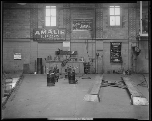 Taylor Tire Company, East Vine and Southeastern Avenue; interior of garage; car lifts and oil cans in garage