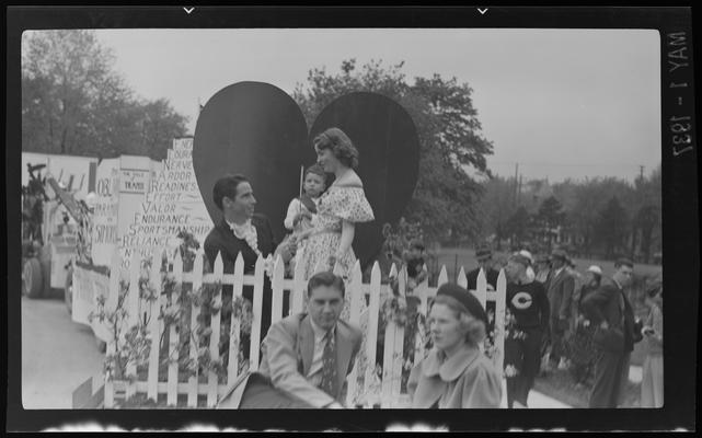 Transylvania (College) Day; man proposing to woman on heart shaped float