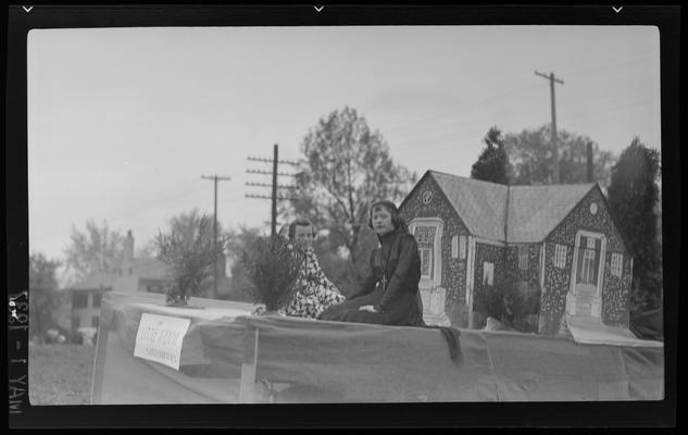 Transylvania (College) Day; two women sitting on float in parade