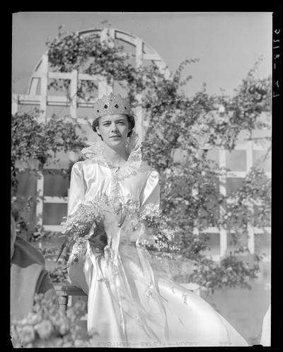 University of Kentucky May Day; queen with crown on holding flowers