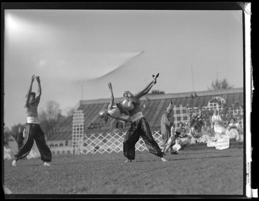 University of Kentucky May Day; acrobats performing on high beam