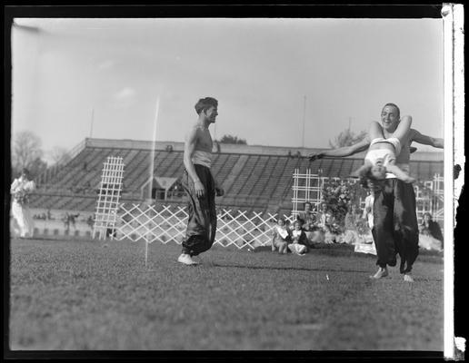 University of Kentucky May Day; acrobats performing on football field