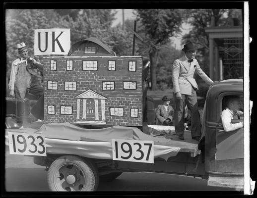 University of Kentucky May Day; float in parade, three girls on front of truck