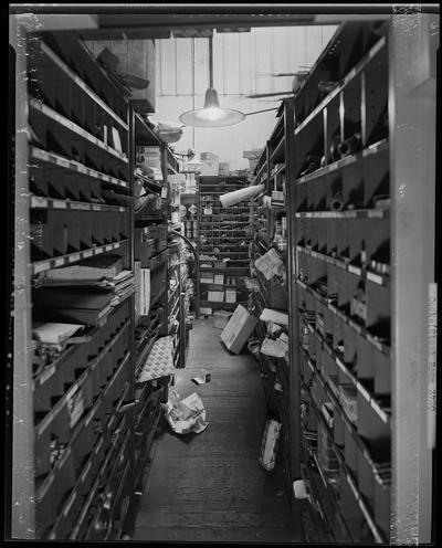 L.R. Cooke Chevrolet (255 East Main); interior of stock room, shelves on both sides