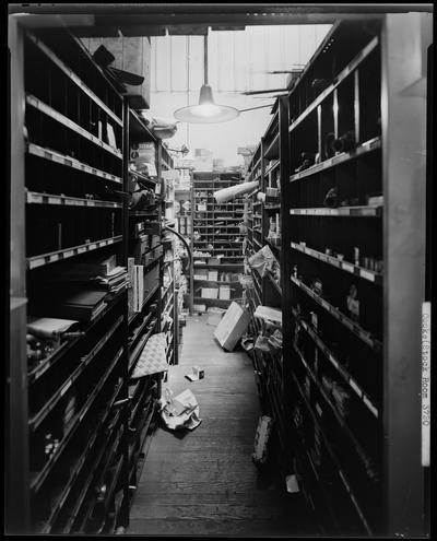 L.R. Cooke Chevrolet (255 East Main); interior of stock room, shelves on both sides