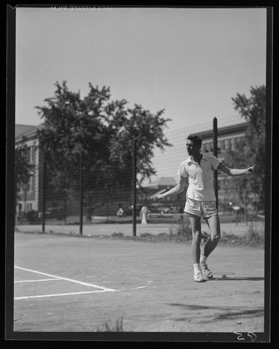 Freshman Tennis (1938 Kentuckian) (University of Kentucky); tennis player hitting ball