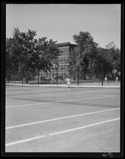 Freshman Tennis (1938 Kentuckian) (University of Kentucky); tennis player hitting ball