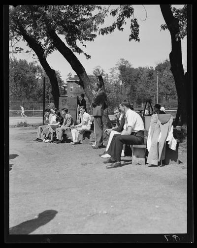 Freshman Tennis (1938 Kentuckian) (University of Kentucky); team sitting on bench watching match