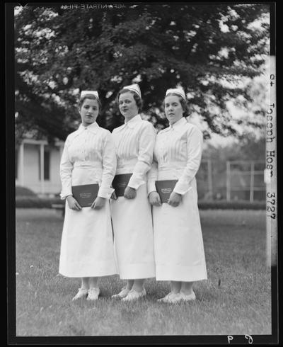 St. Joseph's Hospital, 544 West Second (2nd) Street; three nurses holding diplomas