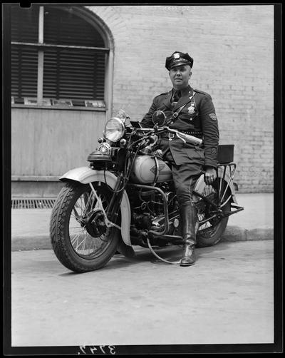 W.C. Jordan; policeman on motorcycle