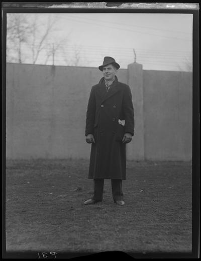 Man in Hat and Overcoat