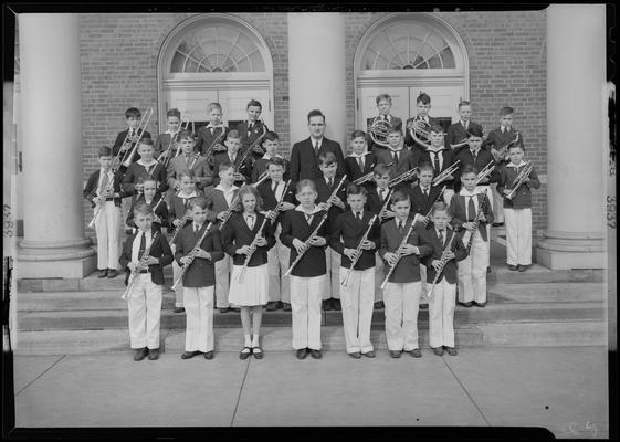Warren Skinner; band standing on steps of unknown building