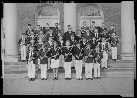 Warren Skinner; band standing on steps of unknown building