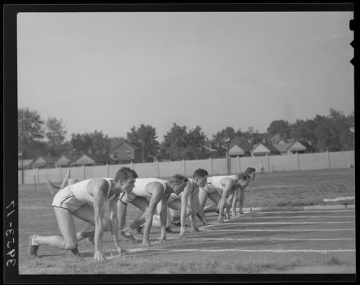 University of Kentucky Track Team (1939 Kentuckian), five team members ready at starting line