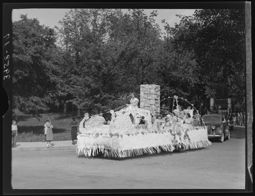 May Queen Activities (1939 Kentuckian) (University of Kentucky), girls riding float (designed with swans), parade