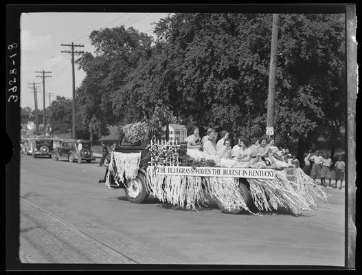 May Queen Activities (1939 Kentuckian) (University of Kentucky), parade, girls riding in the rear of truck labeled 